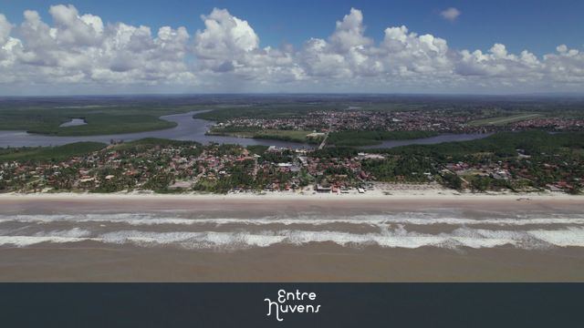 Backward Drone Flyover with Camera Pitch Down over Canavieiras Beach, Brazil